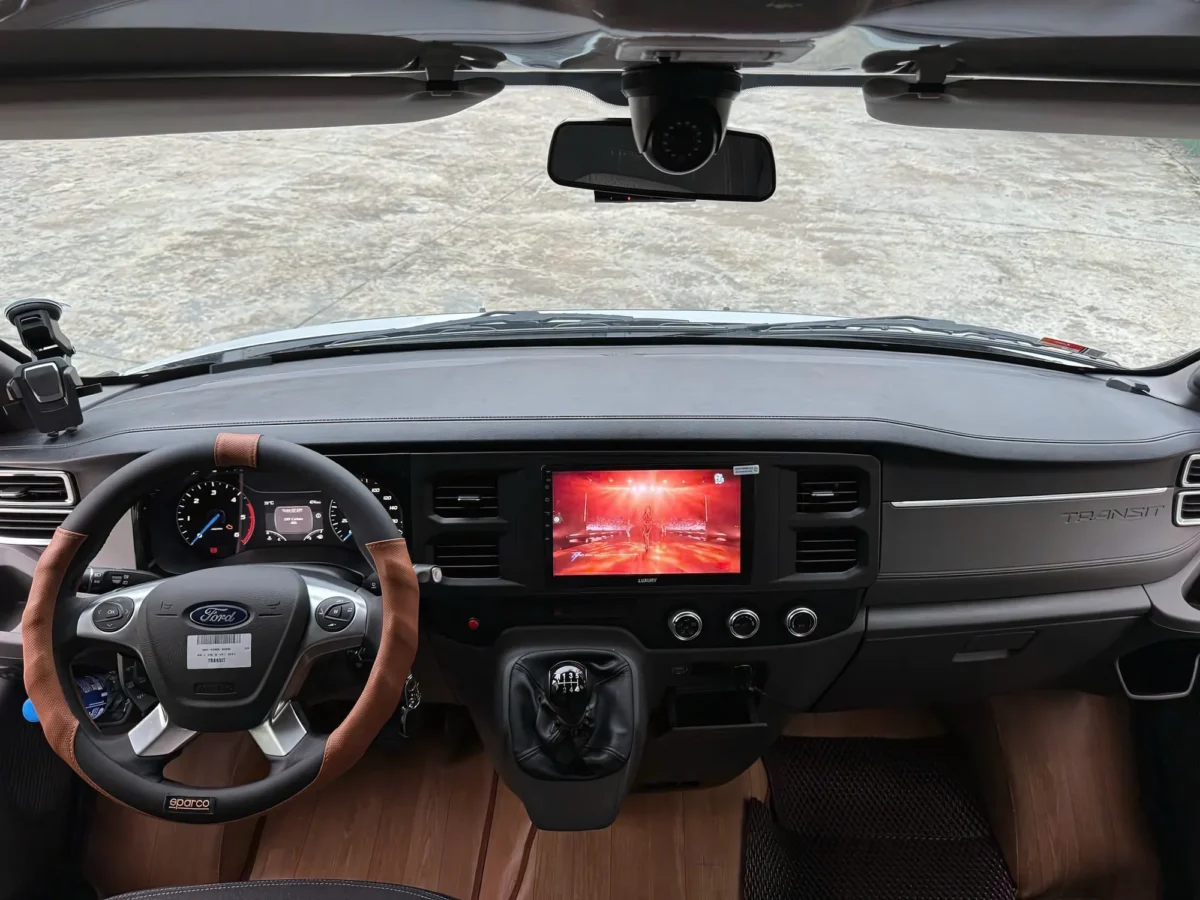 16-seat van dashboard with touchscreen navigation — Hanoi to Ha Long Bay