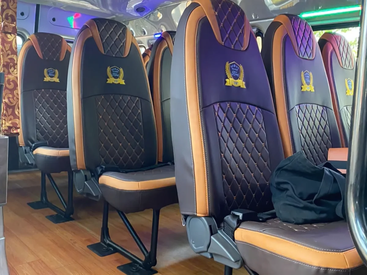 Purple diamond-quilted leather seats in a 16-seat private van