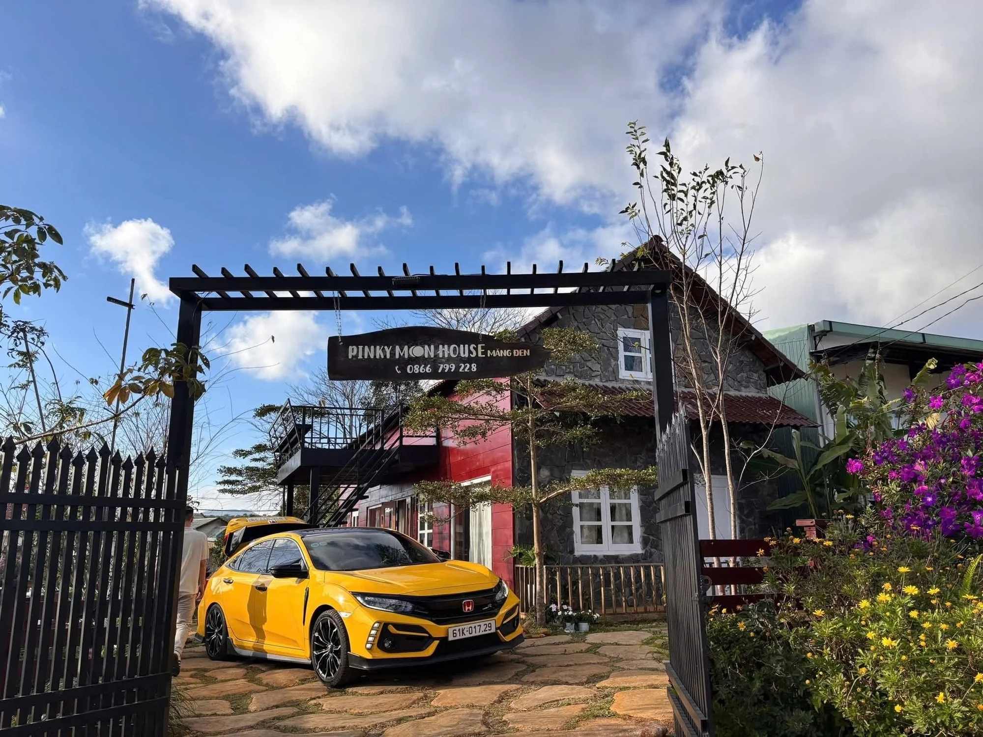 Private car arriving at a highland homestay — door-to-door from Sapa