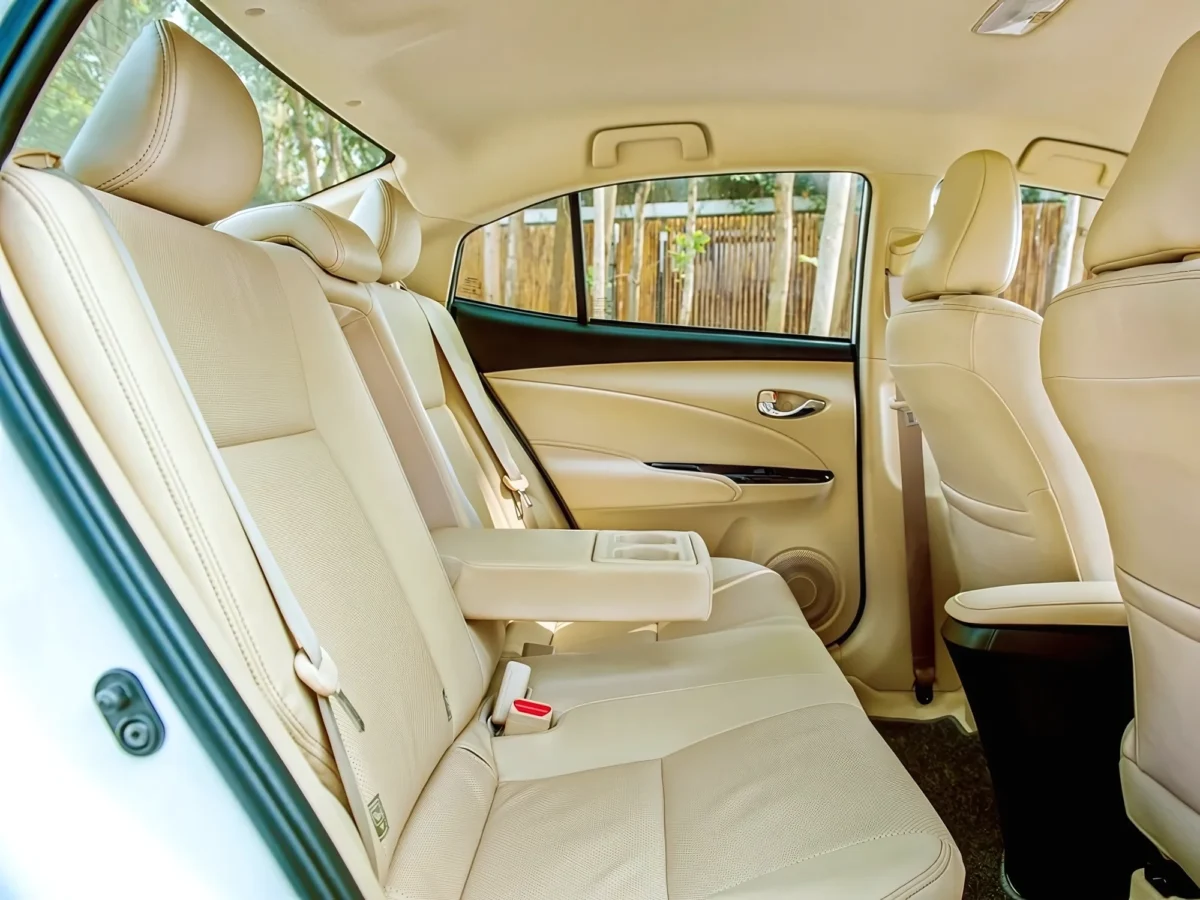Rear seats with fold-down armrest in a 5-seat private car — up to 3 passengers