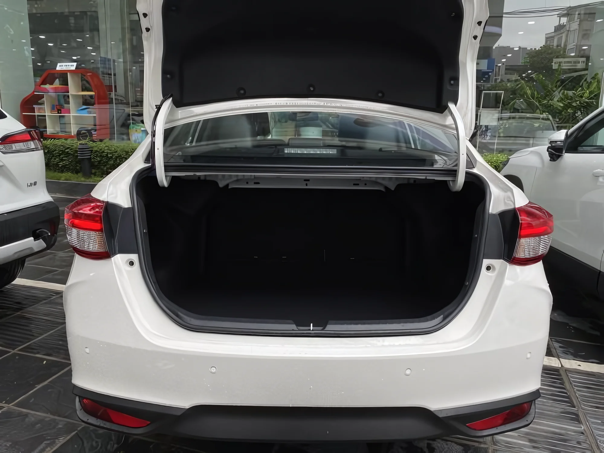 Open boot of a sedan — space for 2 to 3 large suitcases