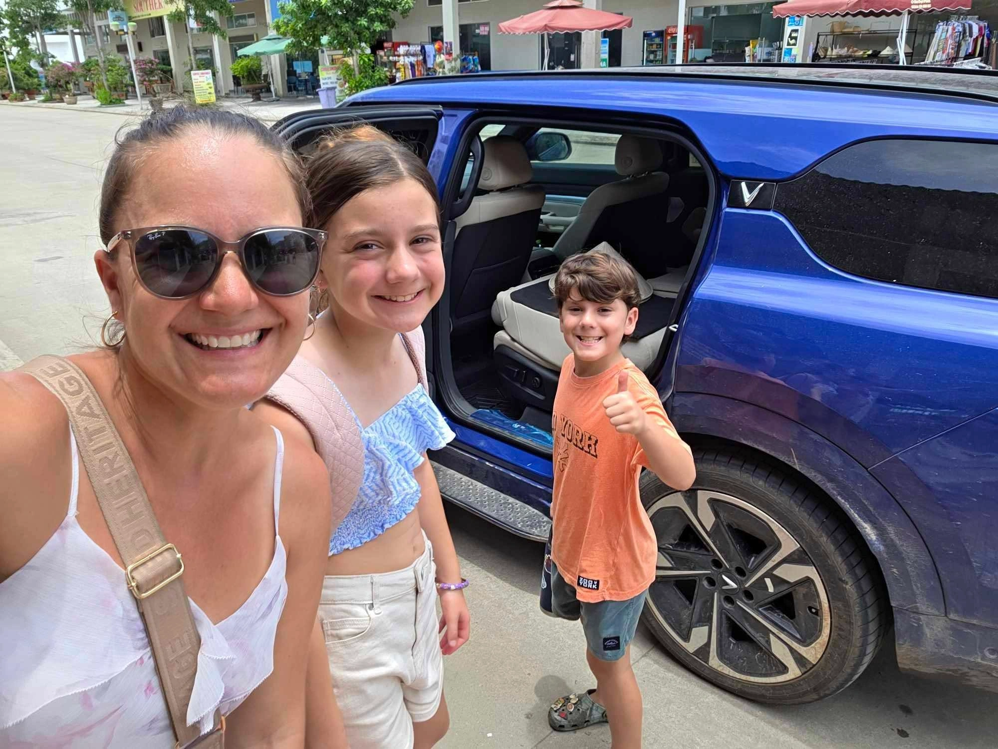 Family with driver beside a 7-seat Private Vietnam SUV in Vietnam