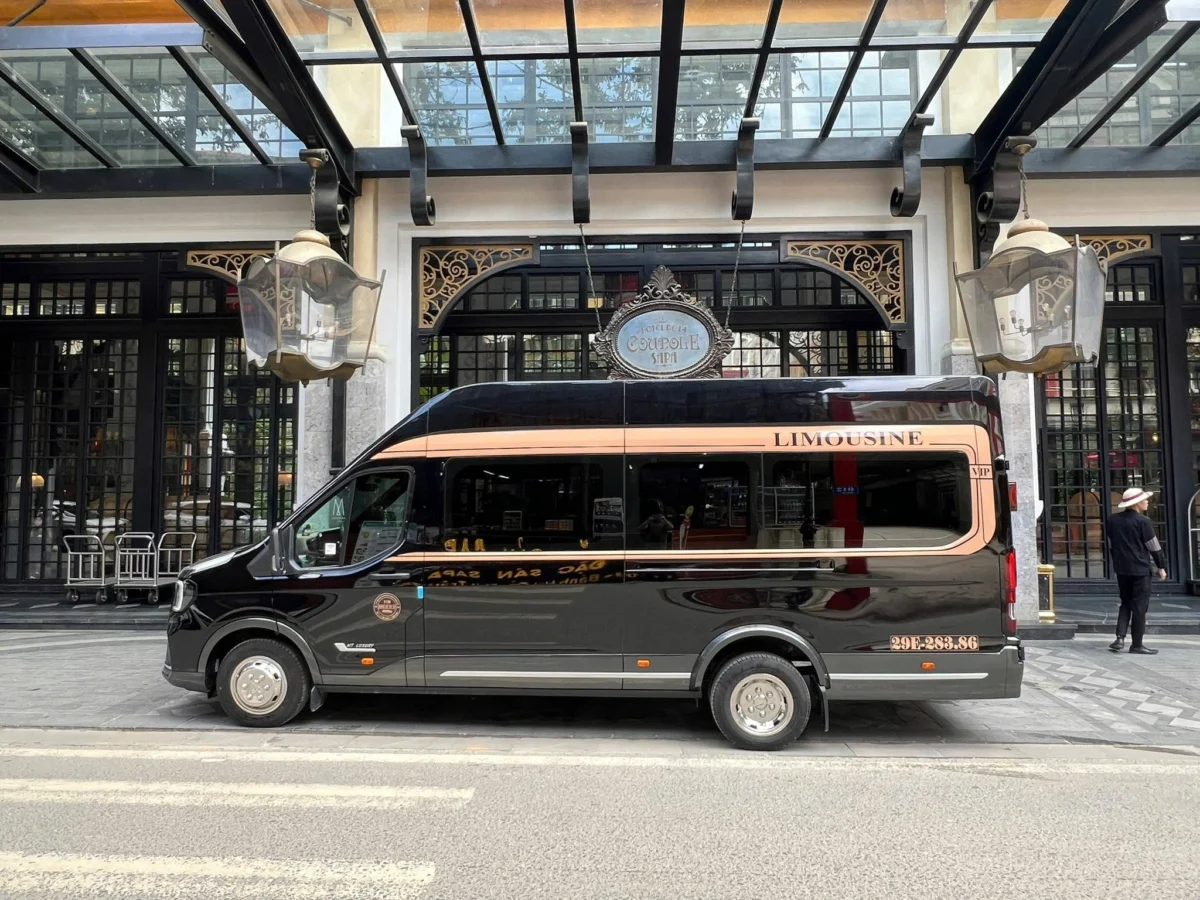 Black VIP limousine van at a luxury hotel — private car from Hanoi to Ha Long Bay