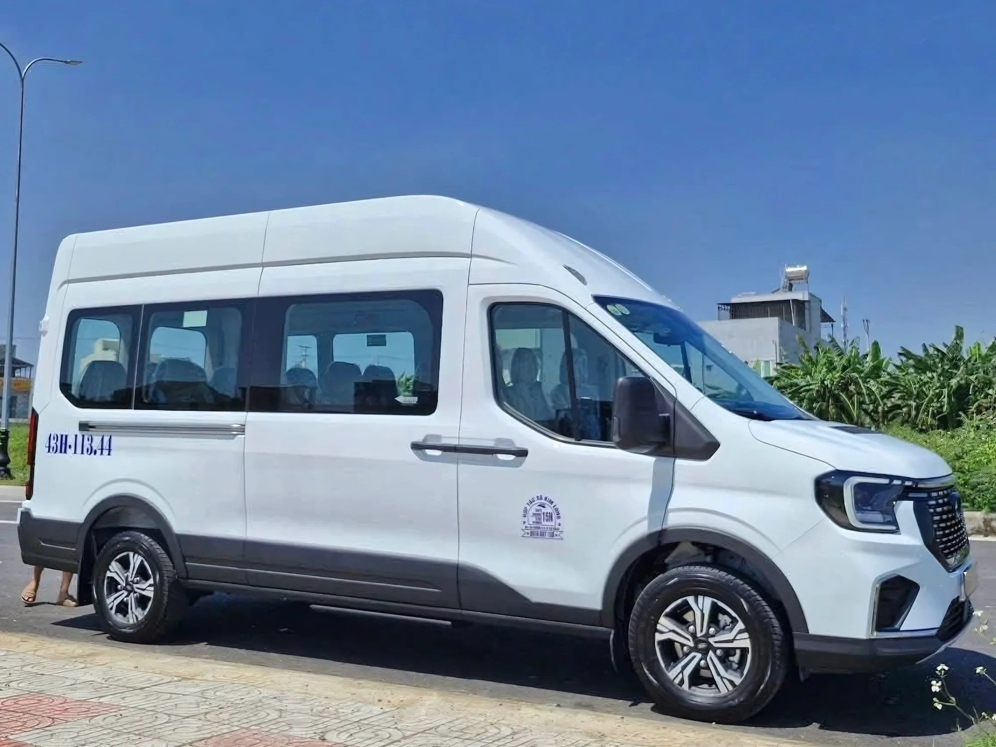 White 9-seat VIP van — more space and comfort than a standard SUV
