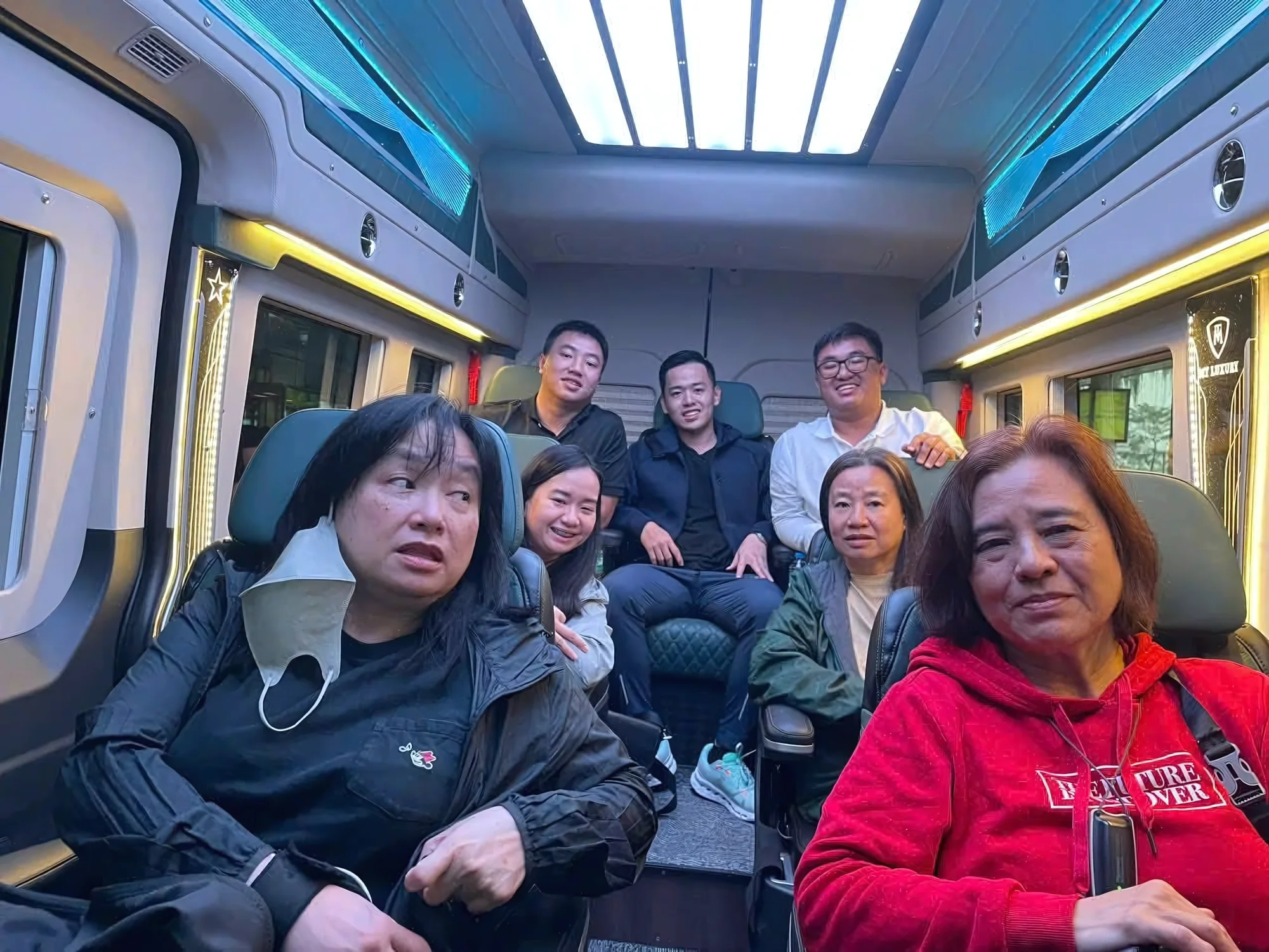 Multi-generational family seated inside a Private Vietnam VIP van