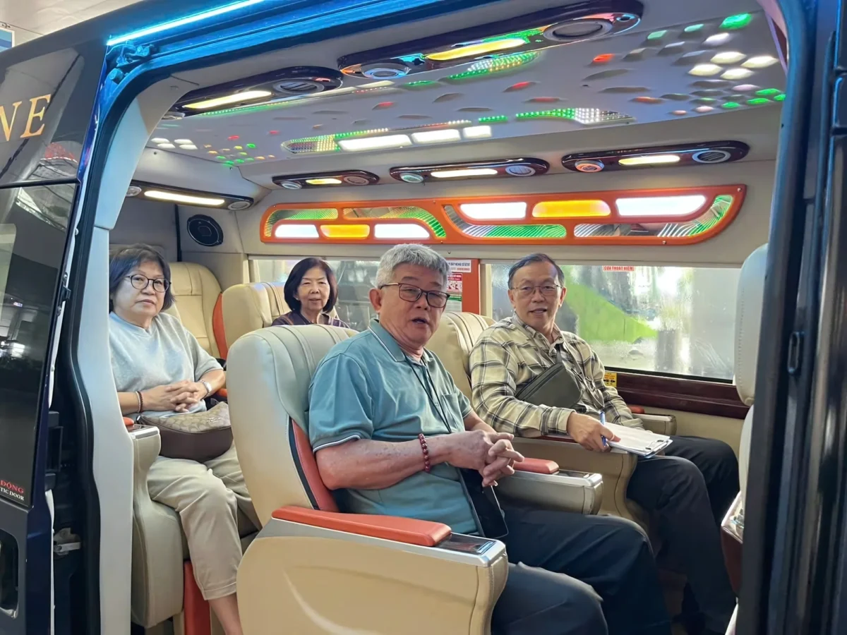 Older passengers in captain seats — VIP private car across Northern Vietnam