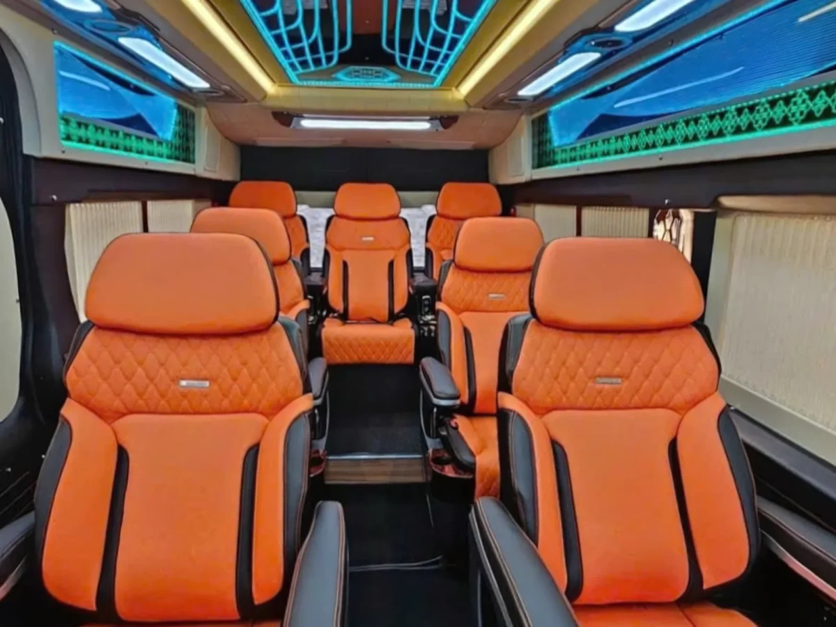 Row of orange quilted leather captain seats with individual recline