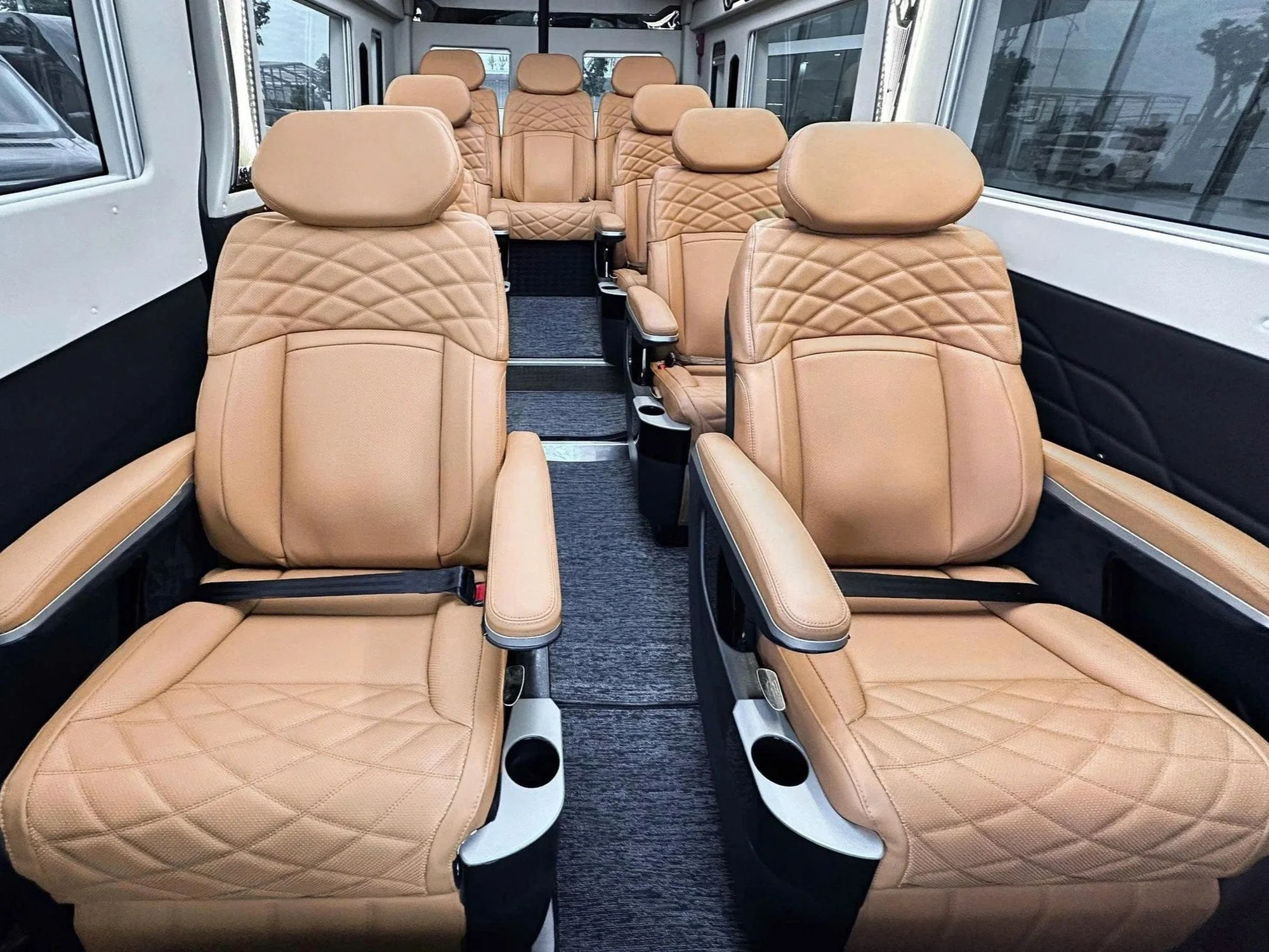 Beige quilted leather captain seats with contrasting stitching