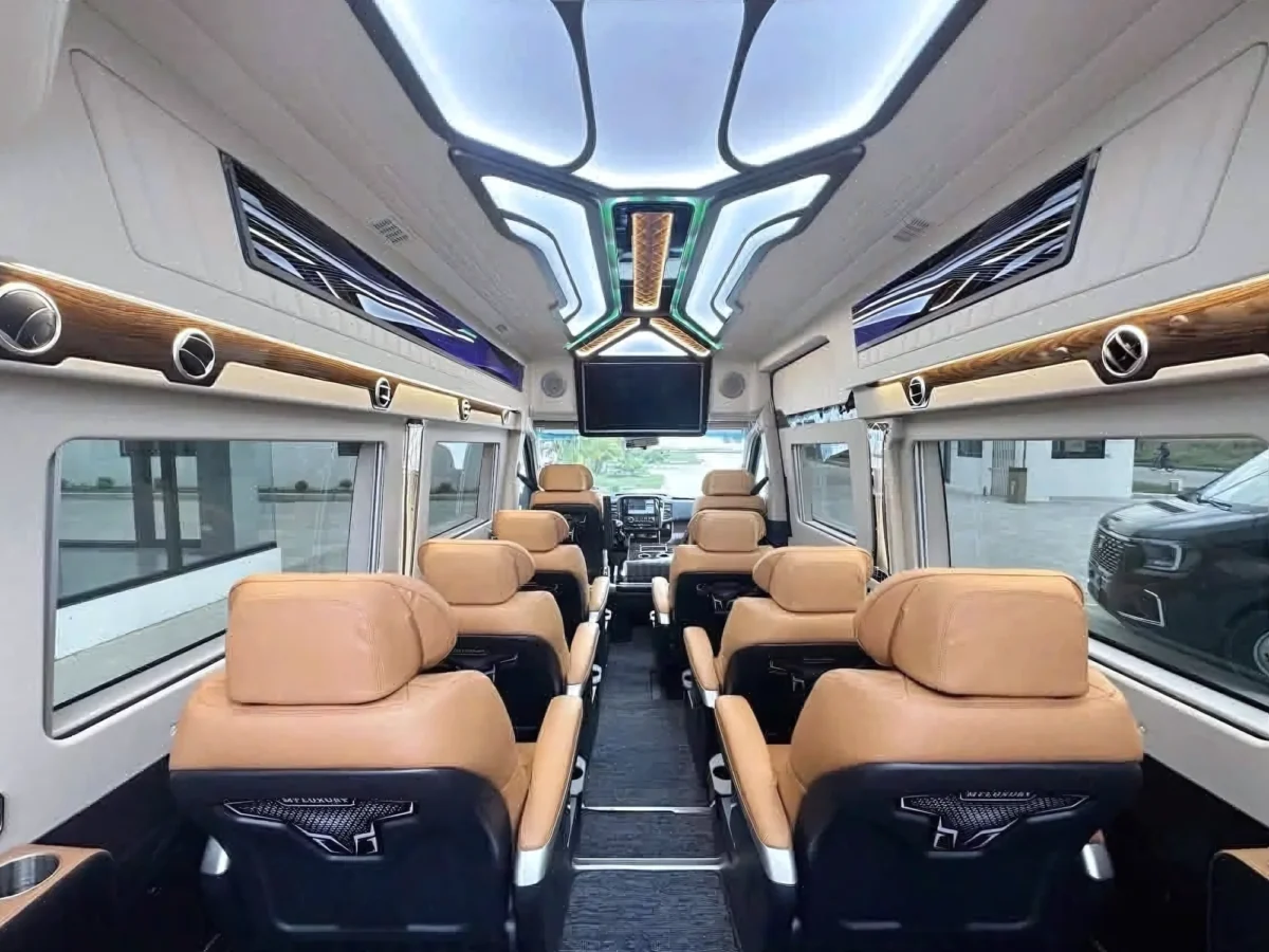 Beige captain seats under a large panoramic sunroof in a VIP private van