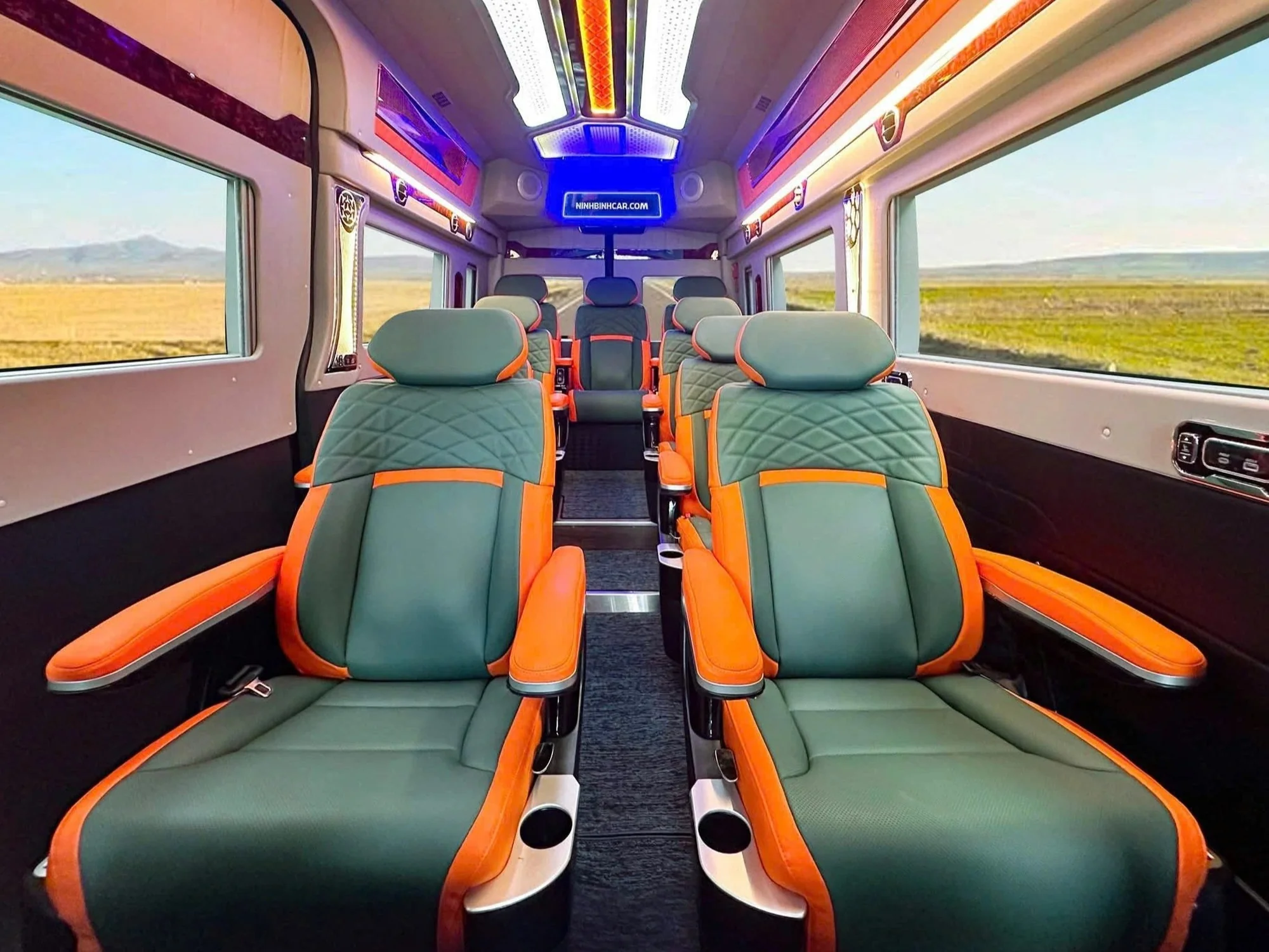 Green and orange leather captain seats — distinctive VIP van interior option