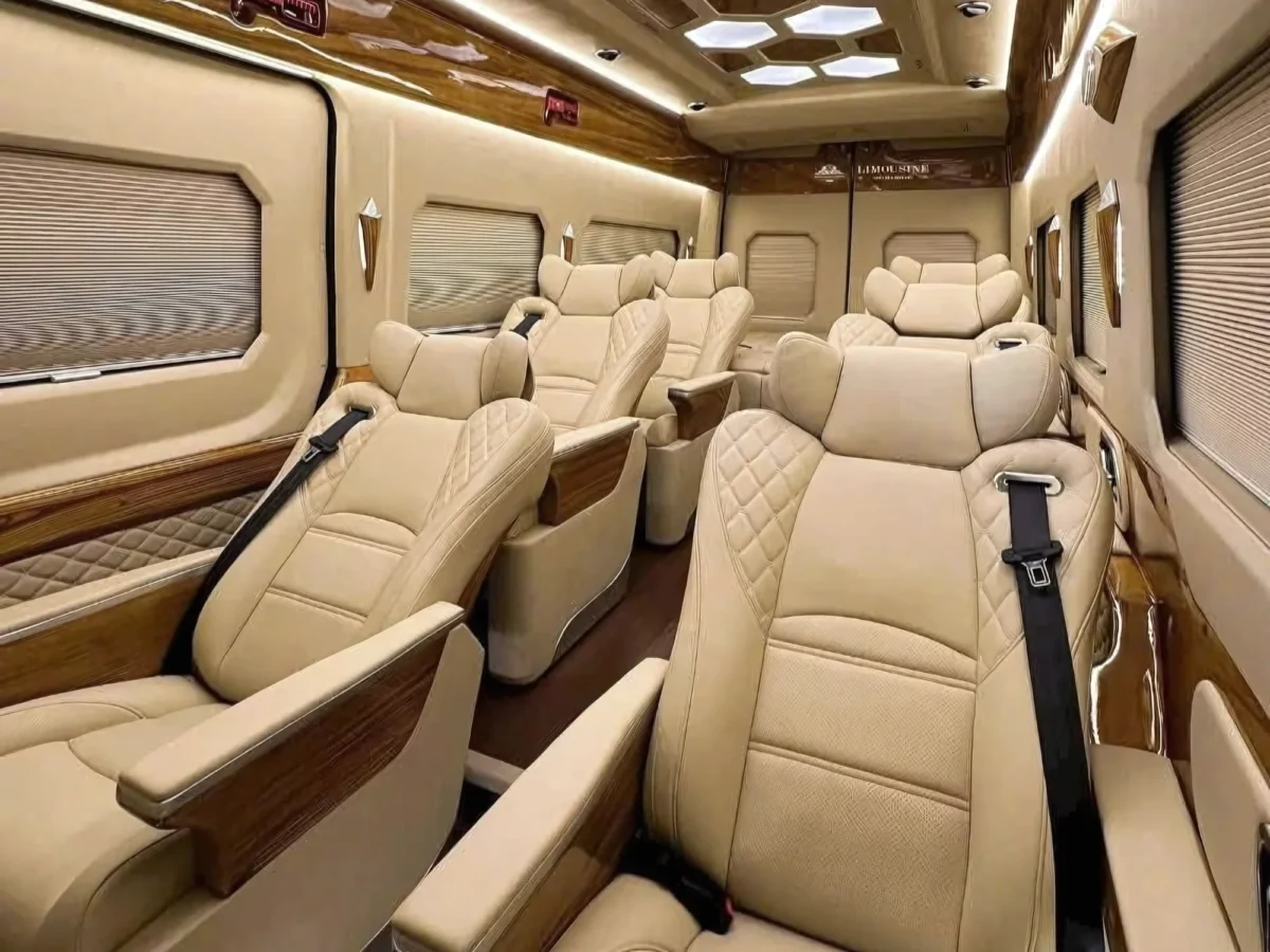 Beige leather seats with LIMOUSINE branding — executive VIP van for Hanoi Ha Long Bay transfer